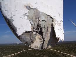 When an unprotected wind-turbine blade is struck by lightning, its temperature will rise (as high as 54,000 F) and severely damage the surface of the blade. It may also melt or crack the blade’s leading edges. Here, the image shows the entry point of a strike.